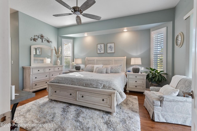 bedroom featuring wood-type flooring and ceiling fan