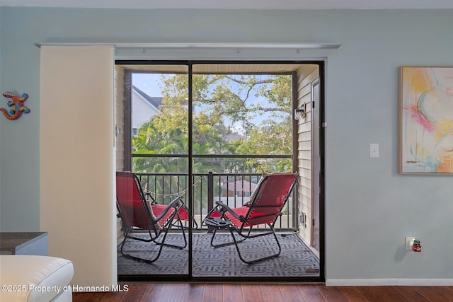 interior space with plenty of natural light and hardwood / wood-style floors