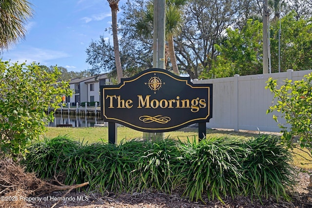 community sign with a water view