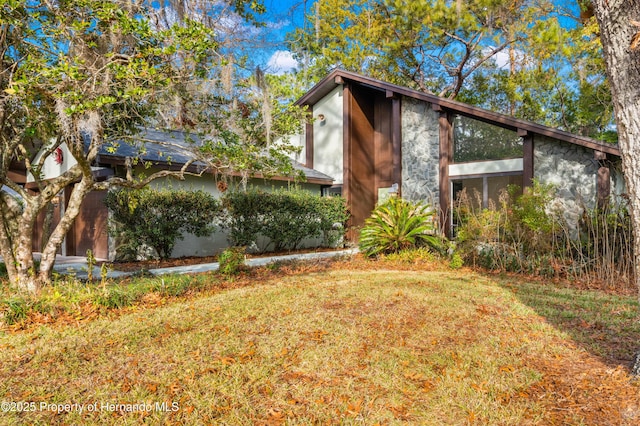 view of property exterior featuring a yard