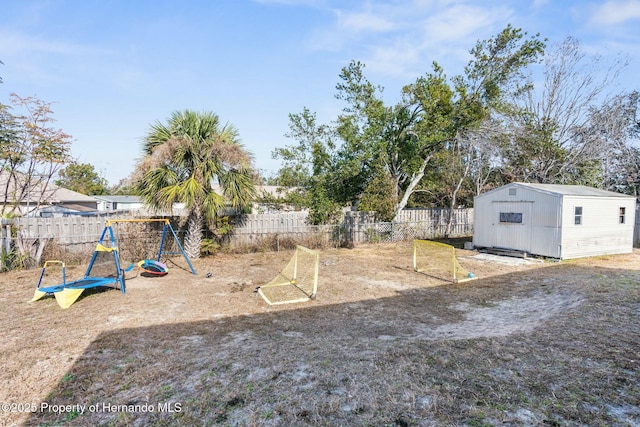 view of yard featuring a shed and a playground