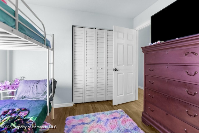 bedroom with light hardwood / wood-style floors