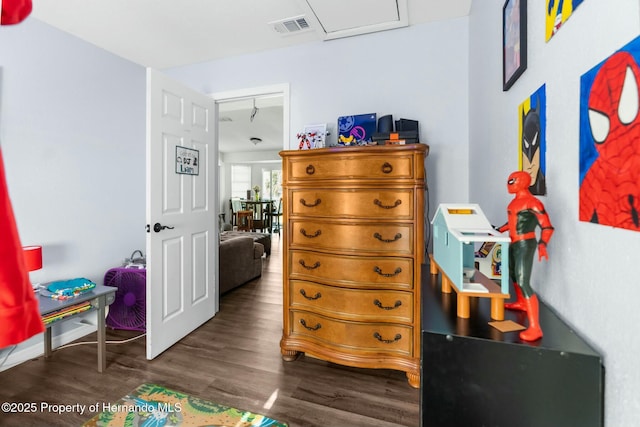 bedroom featuring dark hardwood / wood-style flooring