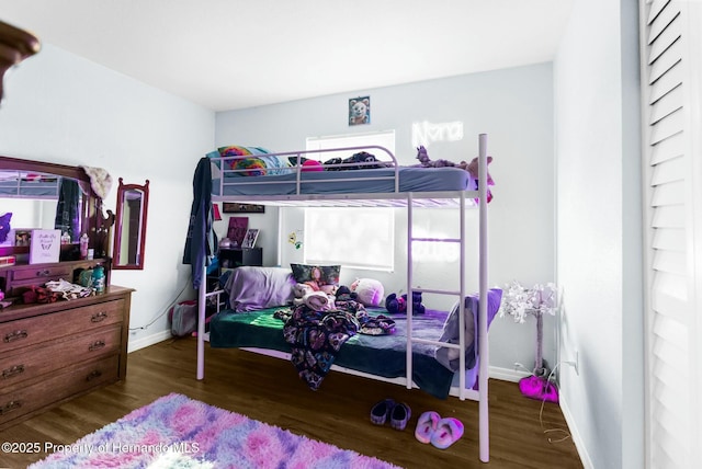 bedroom featuring dark hardwood / wood-style flooring