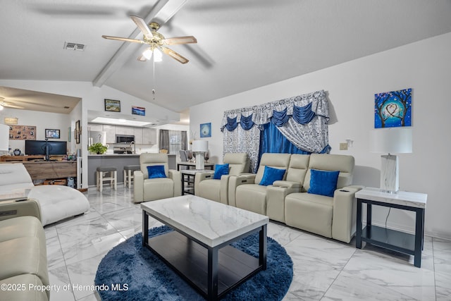 living room with lofted ceiling with beams and ceiling fan