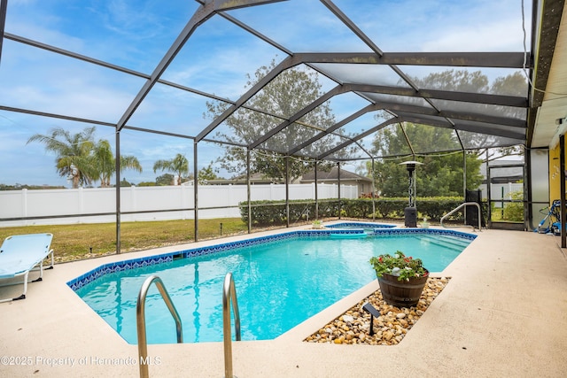 view of pool featuring a lanai, a patio, and an in ground hot tub