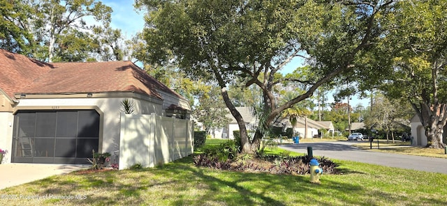 view of side of property featuring a lawn