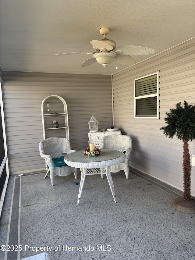 sunroom / solarium with ceiling fan