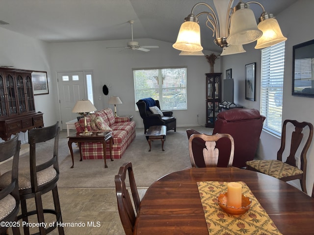 carpeted dining area featuring a ceiling fan, lofted ceiling, a healthy amount of sunlight, and visible vents