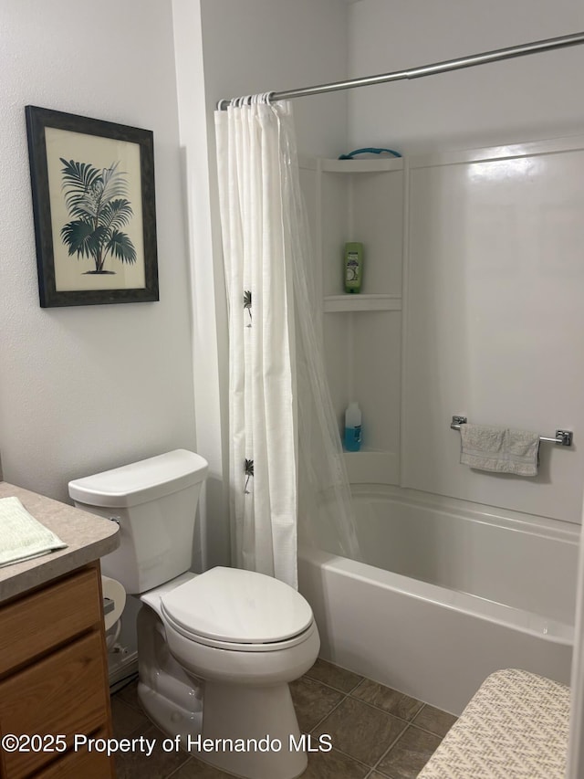 bathroom with toilet, tile patterned flooring, shower / bath combo, and vanity