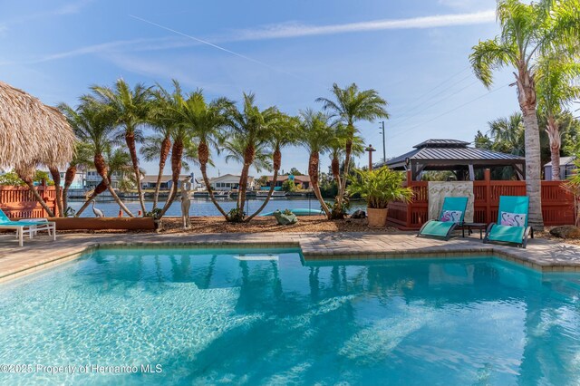 view of pool featuring a gazebo, fence, and a fenced in pool