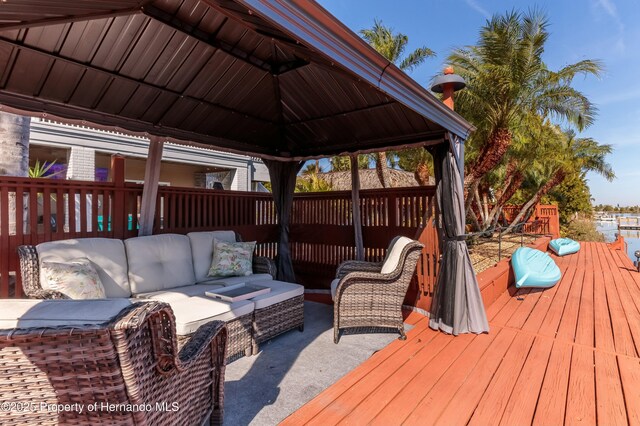 deck with a gazebo and outdoor lounge area