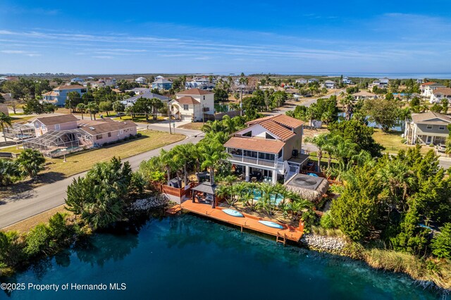bird's eye view with a residential view and a water view
