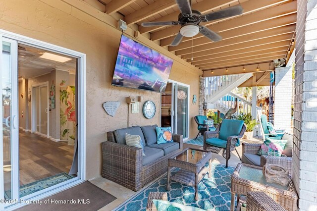 view of patio / terrace with stairs, an outdoor living space, and ceiling fan