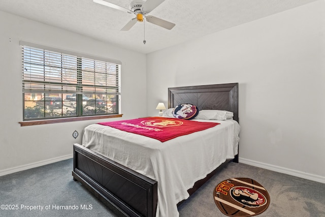 carpeted bedroom with ceiling fan and a textured ceiling