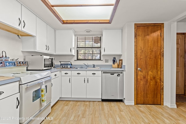 kitchen featuring electric stove, white cabinets, light hardwood / wood-style floors, and dishwasher