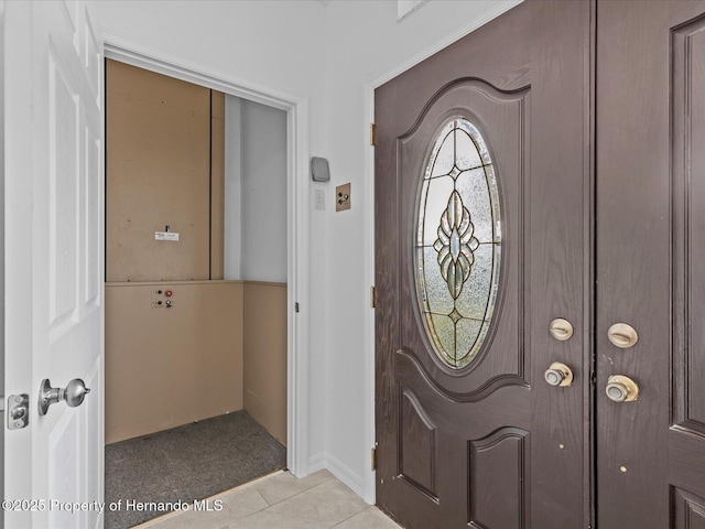 entrance foyer with light tile patterned flooring