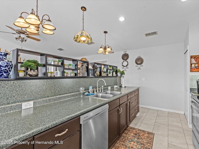 kitchen with dark brown cabinetry, sink, hanging light fixtures, light tile patterned floors, and dishwasher