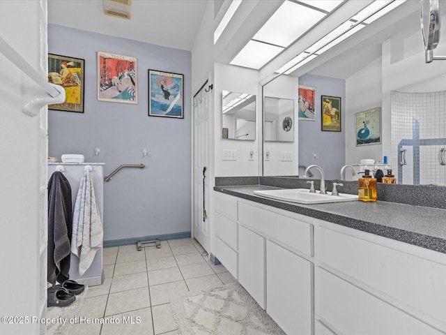 bathroom featuring tile patterned flooring and vanity