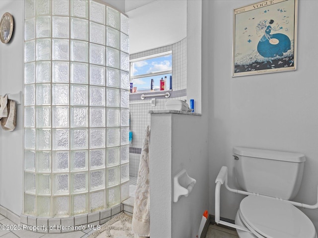 bathroom featuring tile patterned floors and toilet