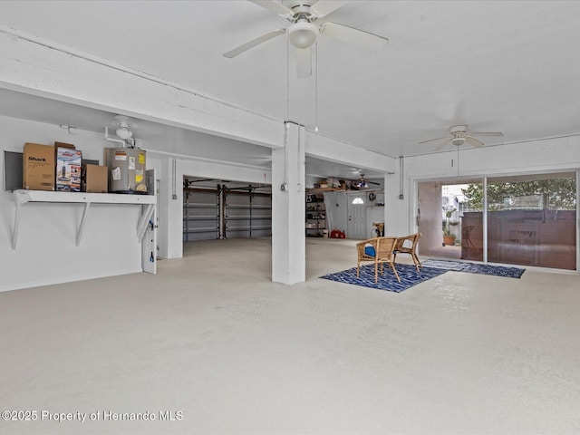 living room with concrete flooring, electric water heater, and ceiling fan