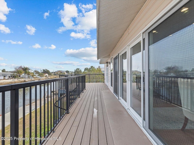 wooden deck featuring a water view