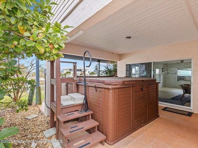 deck featuring a hot tub