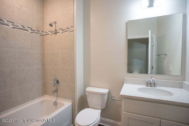 full bathroom with vanity, toilet, and tiled shower / bath combo