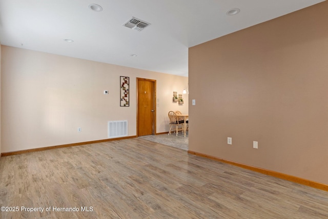 unfurnished room featuring light hardwood / wood-style floors