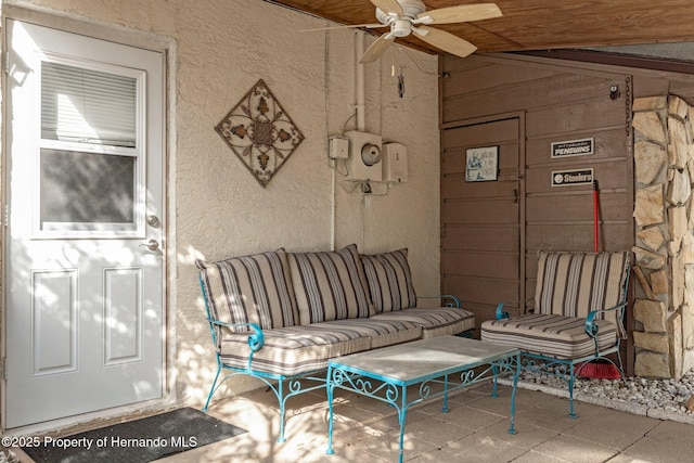 living room featuring lofted ceiling and ceiling fan