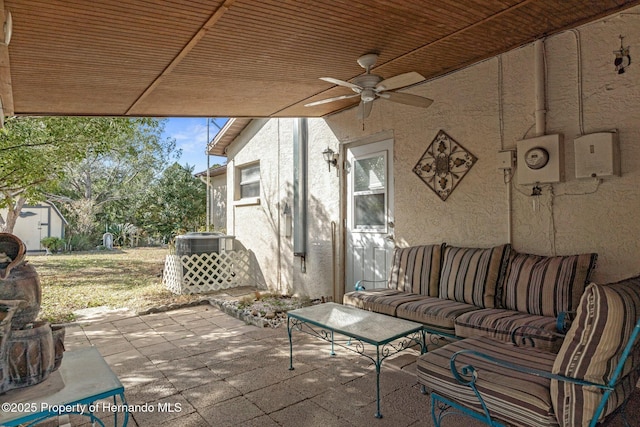 view of patio with outdoor lounge area and ceiling fan