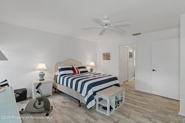 bedroom featuring ceiling fan and light wood-type flooring