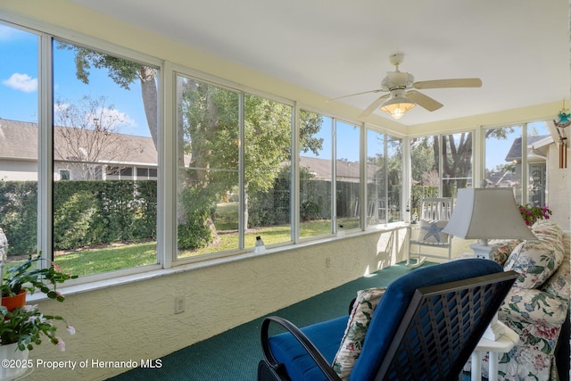 sunroom / solarium with ceiling fan