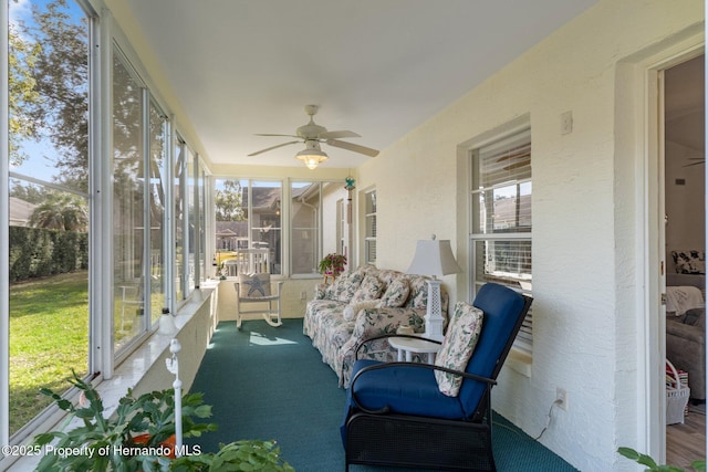 sunroom with ceiling fan