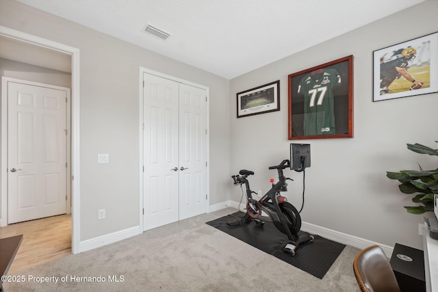 exercise area featuring carpet floors