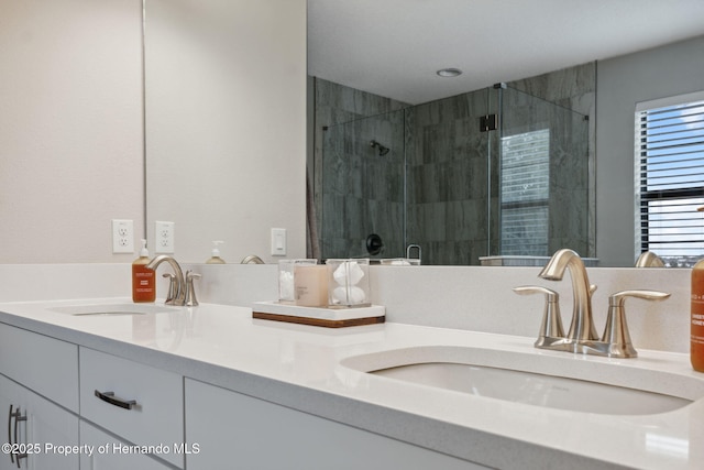 bathroom with vanity and an enclosed shower