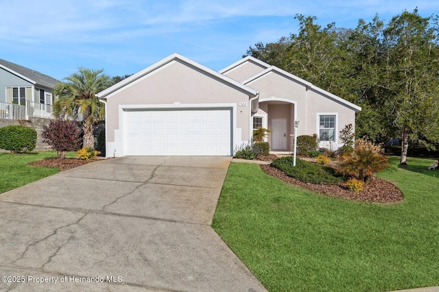 single story home with a garage and a front lawn