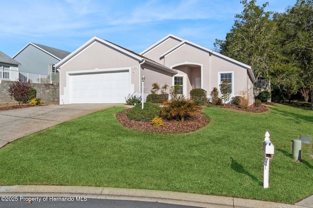 ranch-style house with a garage and a front lawn