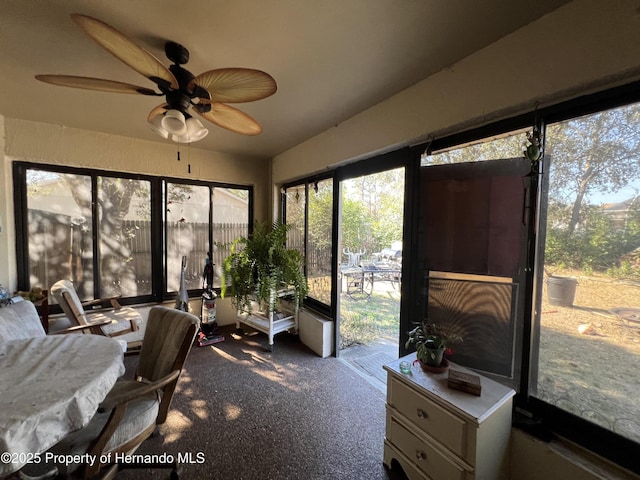 sunroom / solarium with ceiling fan