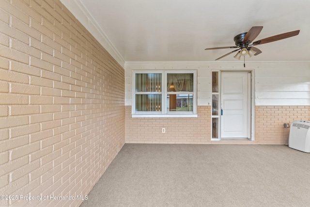 exterior space with ceiling fan