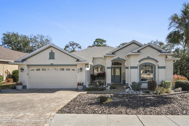 single story home with a garage