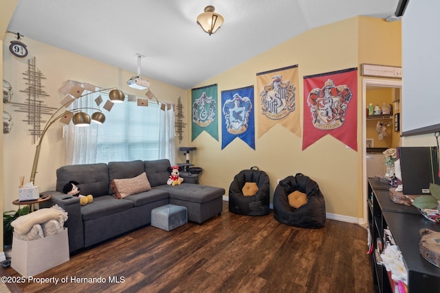 living room with lofted ceiling and dark hardwood / wood-style flooring