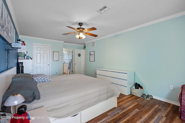 bedroom with ornamental molding, dark hardwood / wood-style floors, and a textured ceiling