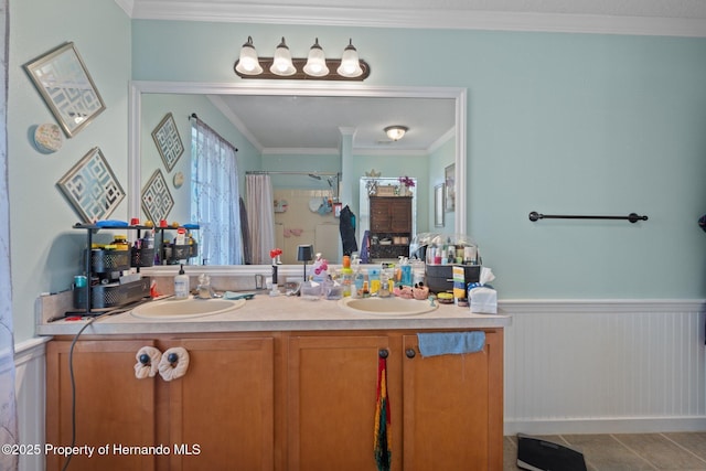 bathroom featuring vanity, crown molding, and a shower with curtain