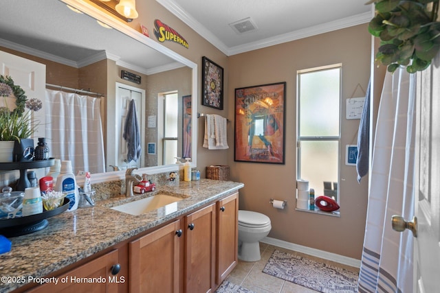 bathroom with tile patterned flooring, vanity, ornamental molding, and toilet