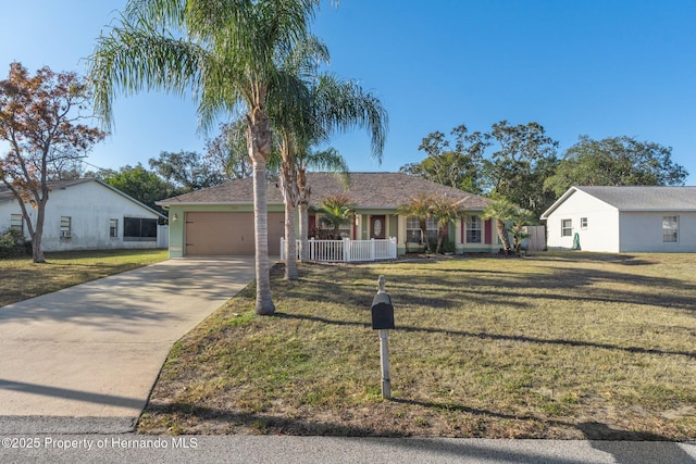 ranch-style home with a garage, a porch, and a front yard