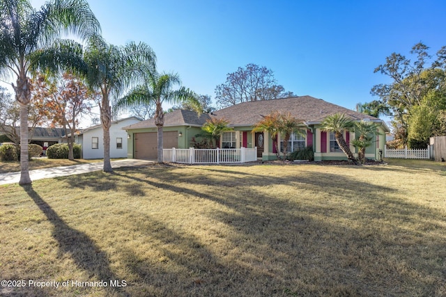 ranch-style house with a garage and a front lawn