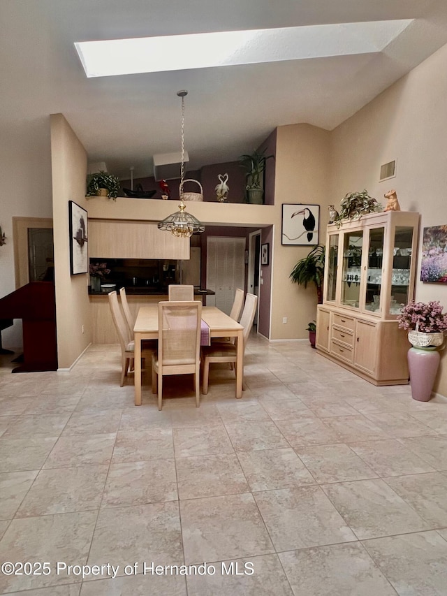 dining room featuring lofted ceiling