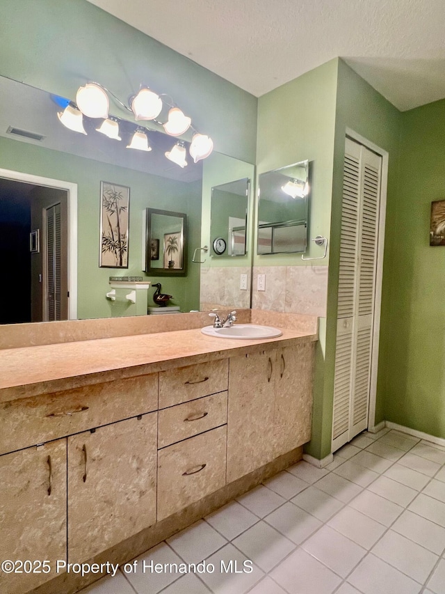 bathroom featuring vanity and tile patterned flooring