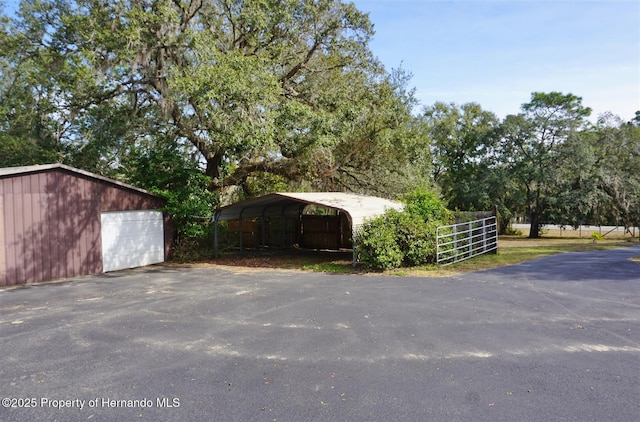 view of outbuilding featuring a carport